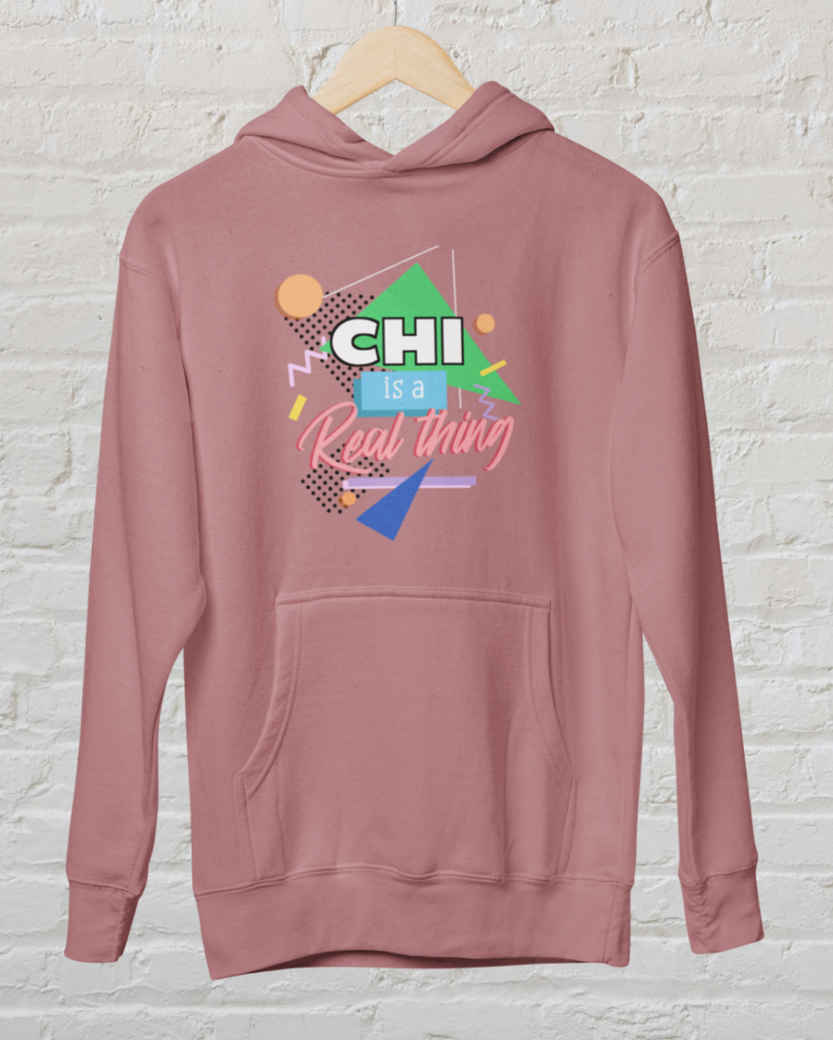 hoodie dusty rose 'Chi is a real thing' design white brick backround