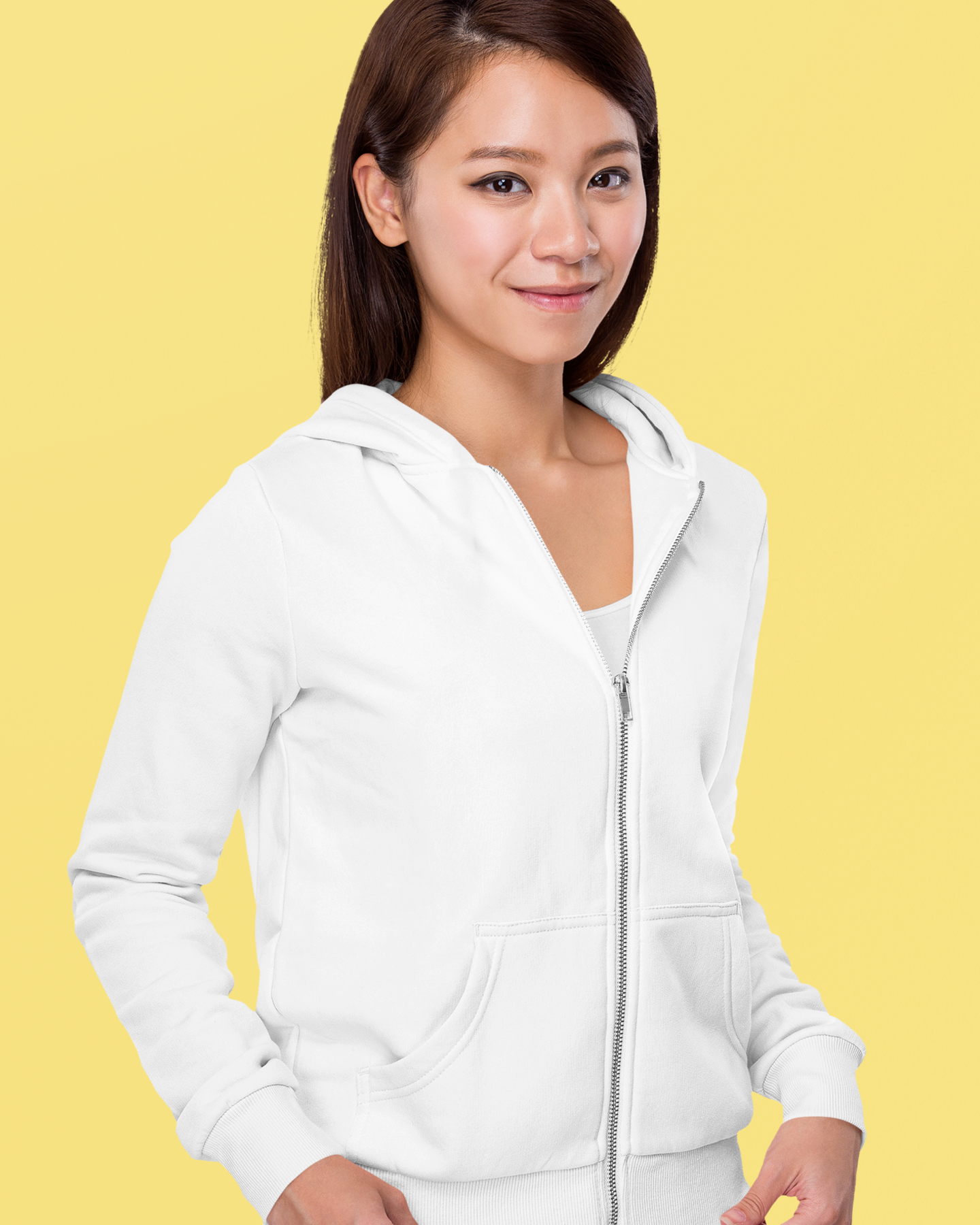 front view of a happy female model wearing a white zip up hoodie