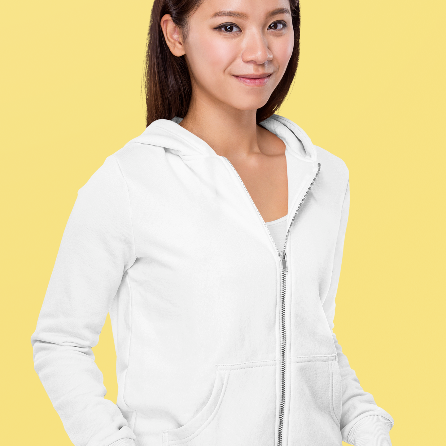 front view of a smiling lady wearing a white zip up hoodie