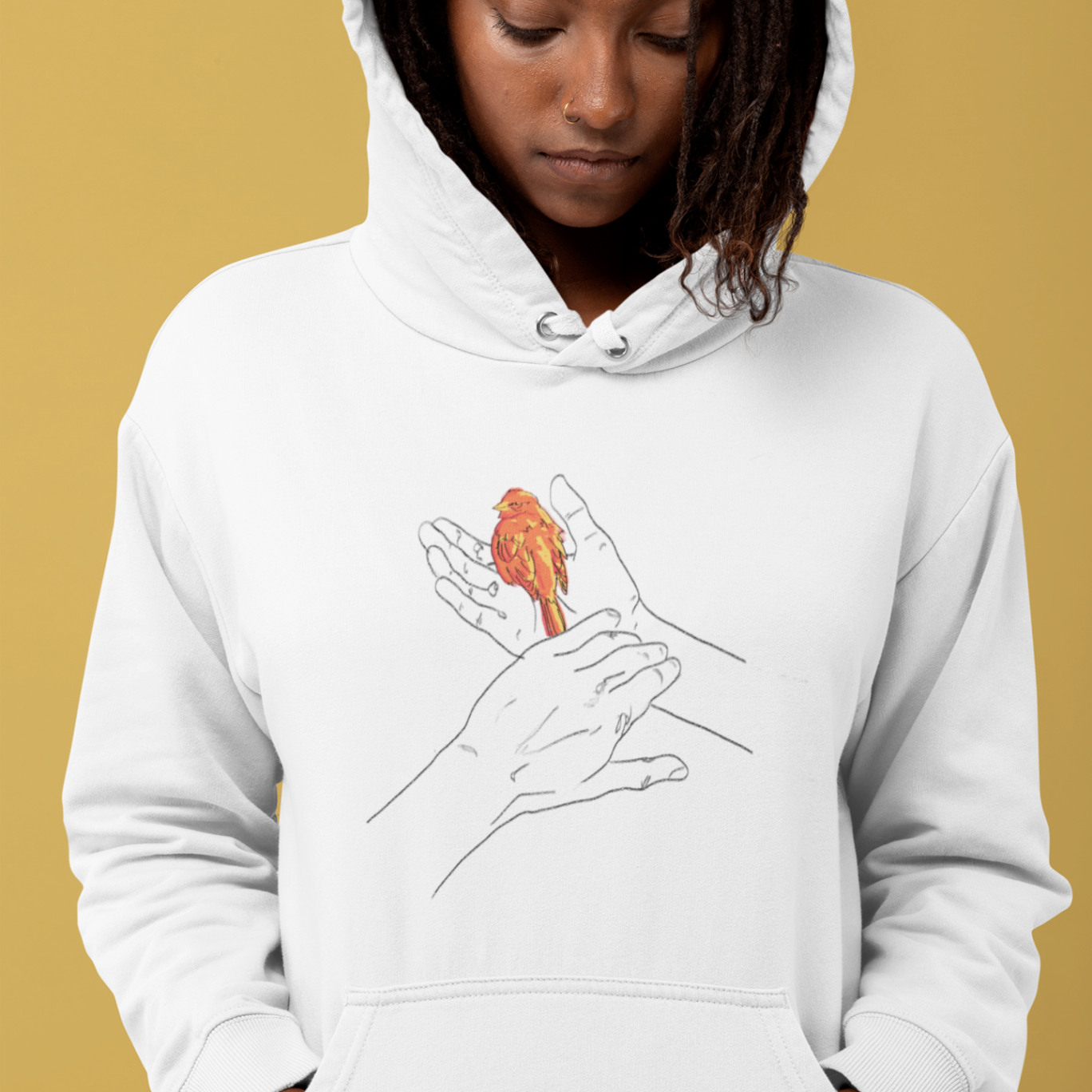 a cool looking woman wearing a white hoodie with the grasp sparrows tail design on front