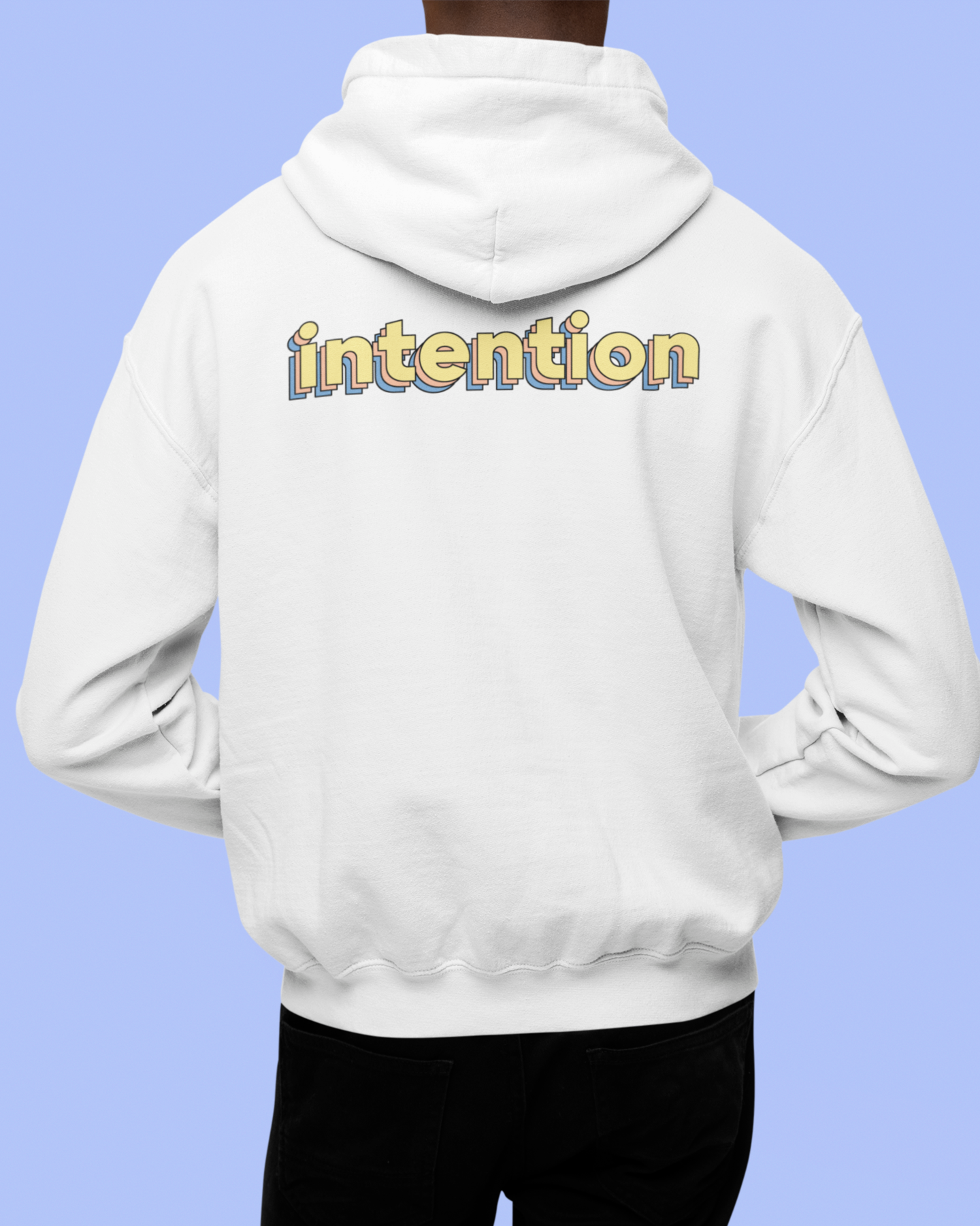 back view of a male model wearing a white zip up hoodie with intention written in 3 D lettering across the shoulders
