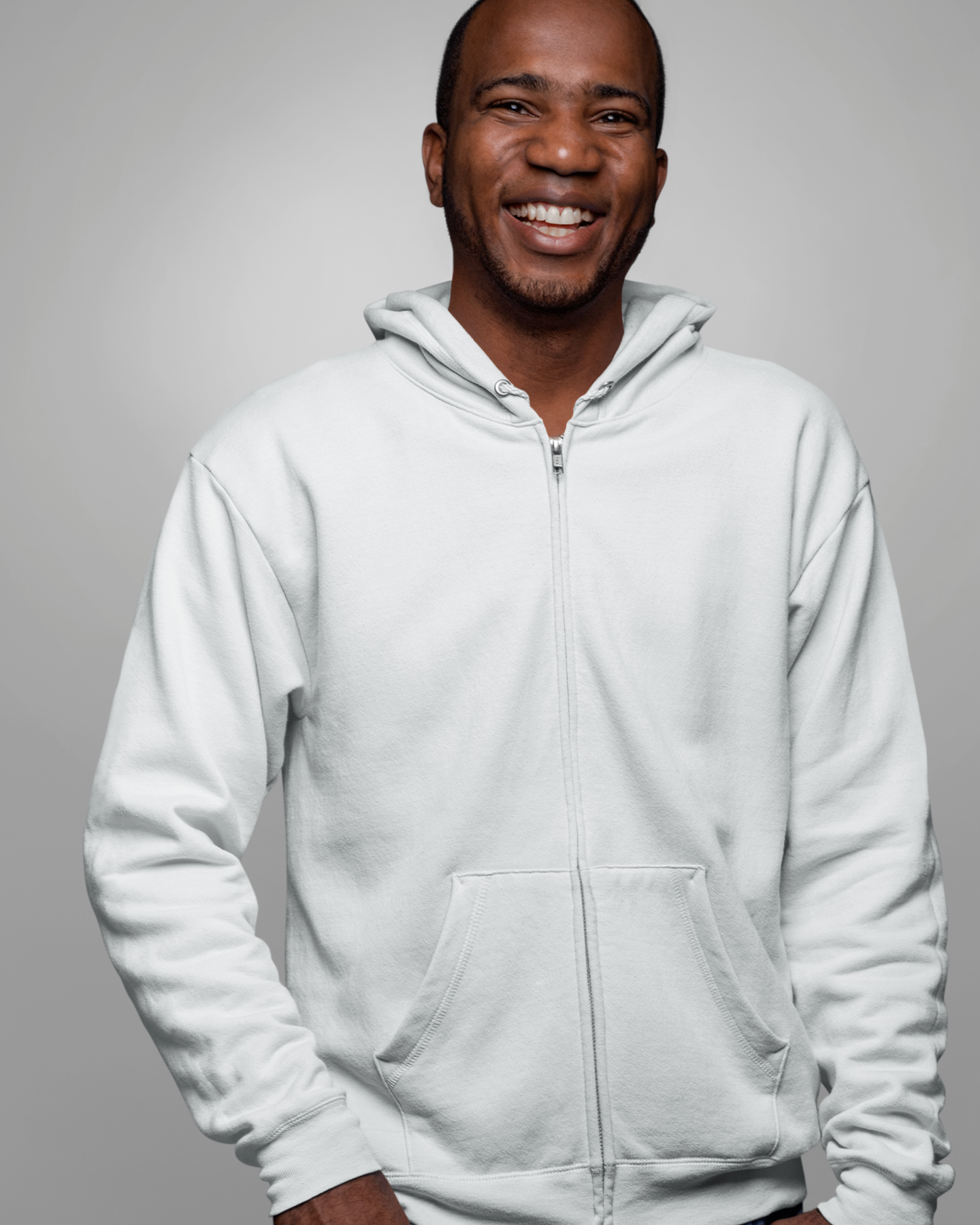 front view of a happy model wearing a white zip up hoodie